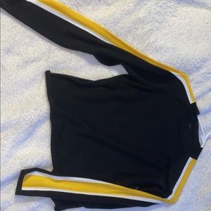 Black fitted shirt with yellow sleeve stripe